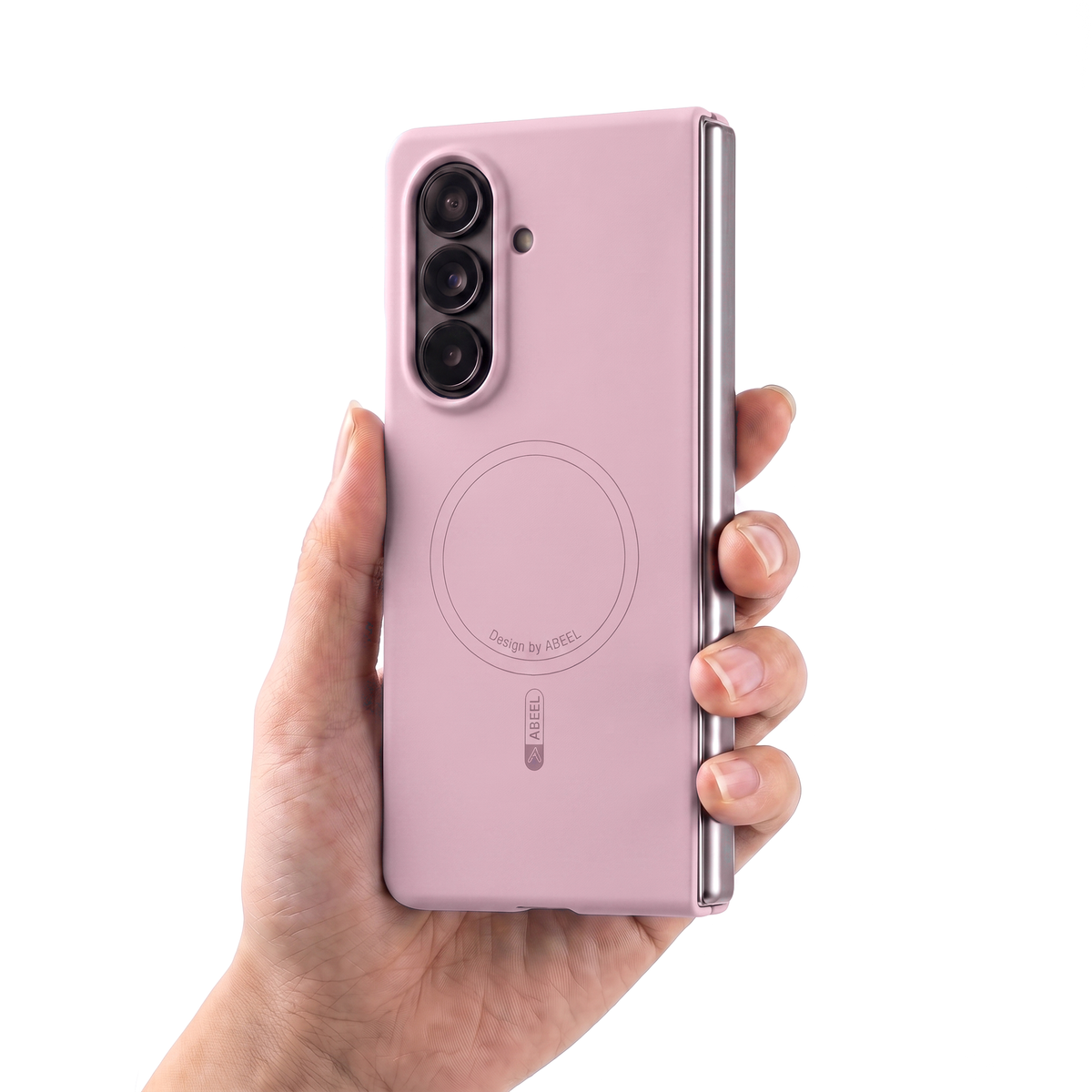 Hand holding a Galaxy Z Fold in the Pink Apex M3 case, showing its slim in-hand feel