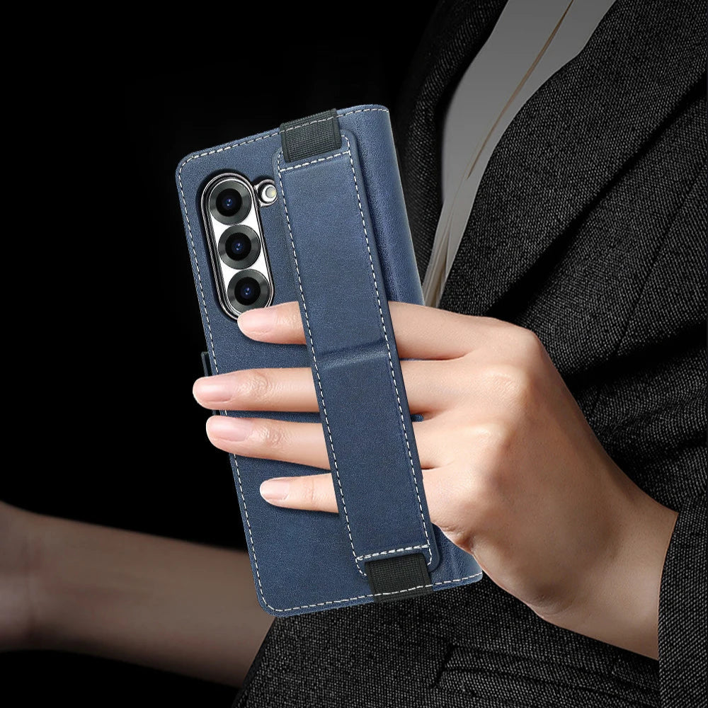 Person holding a blue phone case with a phone inside against a dark background